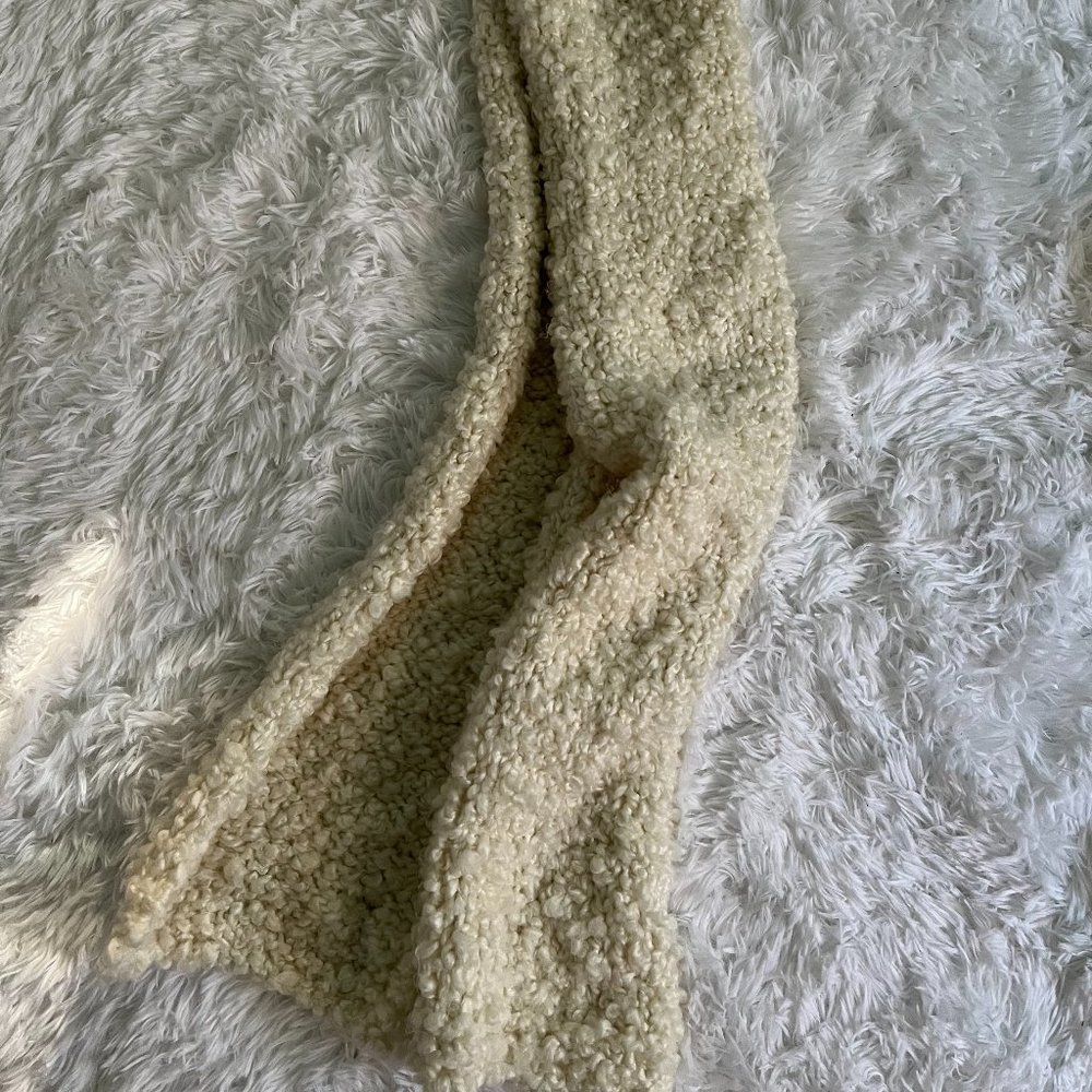 Fluffy white hand-knit scarf
